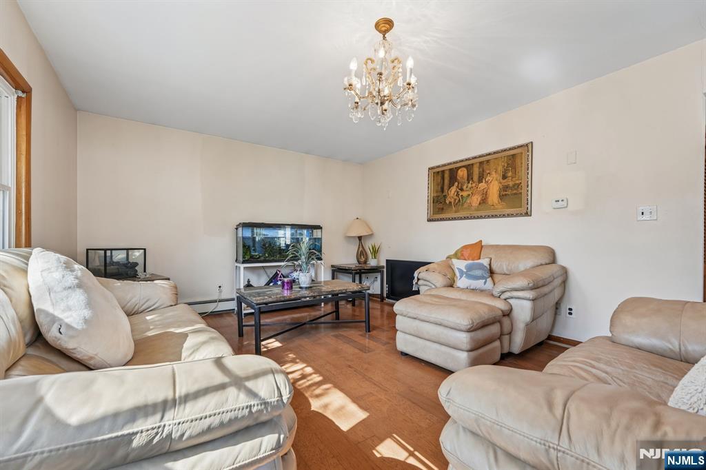 140 Francisco Avenue Rutherford, NJ 07070 - Photo 4 of 25 a living room with furniture and a flat screen tv