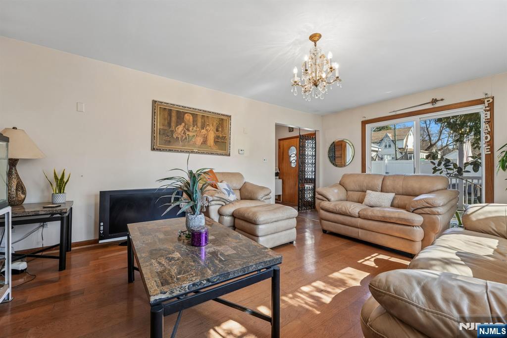 140 Francisco Avenue Rutherford, NJ 07070 - Photo 5 of 25 a living room with furniture and a chandelier