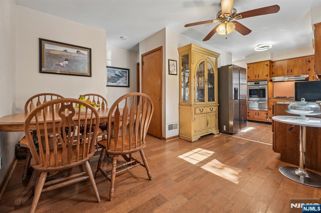 140 Francisco Avenue Rutherford, NJ 07070 - Photo 7 of 25 a view of a dining room with furniture and a kitchen
