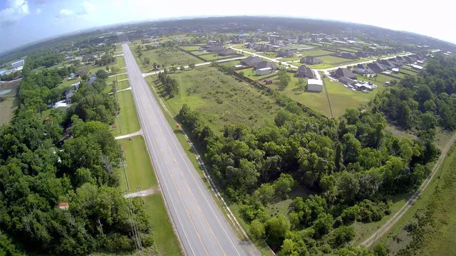 an aerial view of residential houses with outdoor space