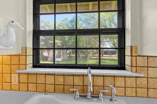 a utility room with cabinets washer and dryer