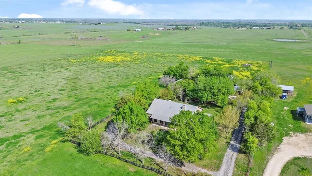 a view of a field with an ocean