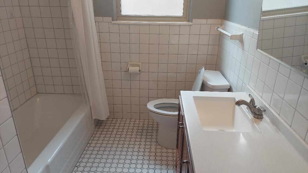 1807 Barbara Street Austin, TX 78757 - Photo 25 of 25 a bathroom with a sink a toilet and bathtub