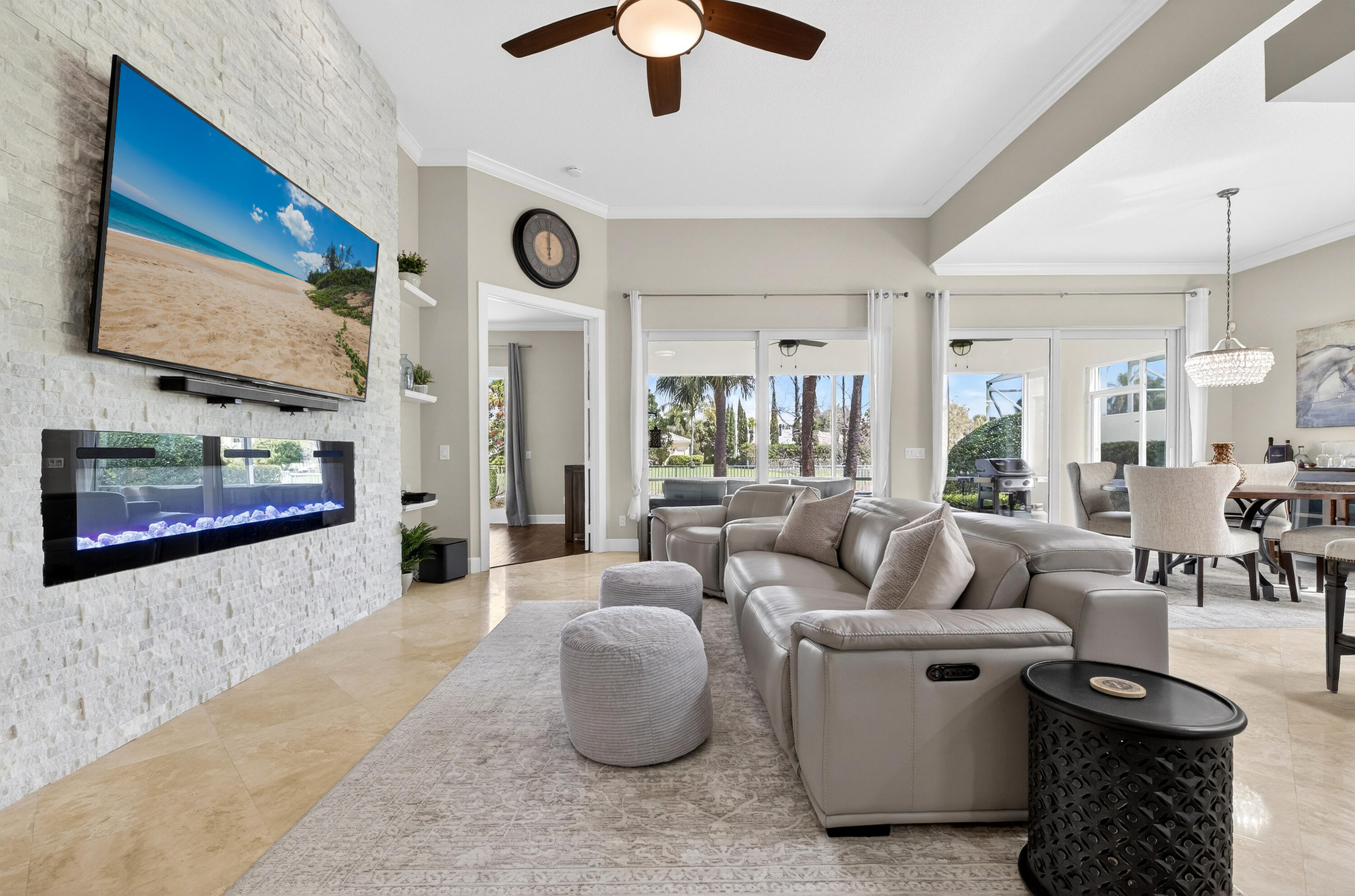 8223 Pine Cay Road Wellington, FL 33414 - Photo 11 of 60 a living room with furniture and a large mirror