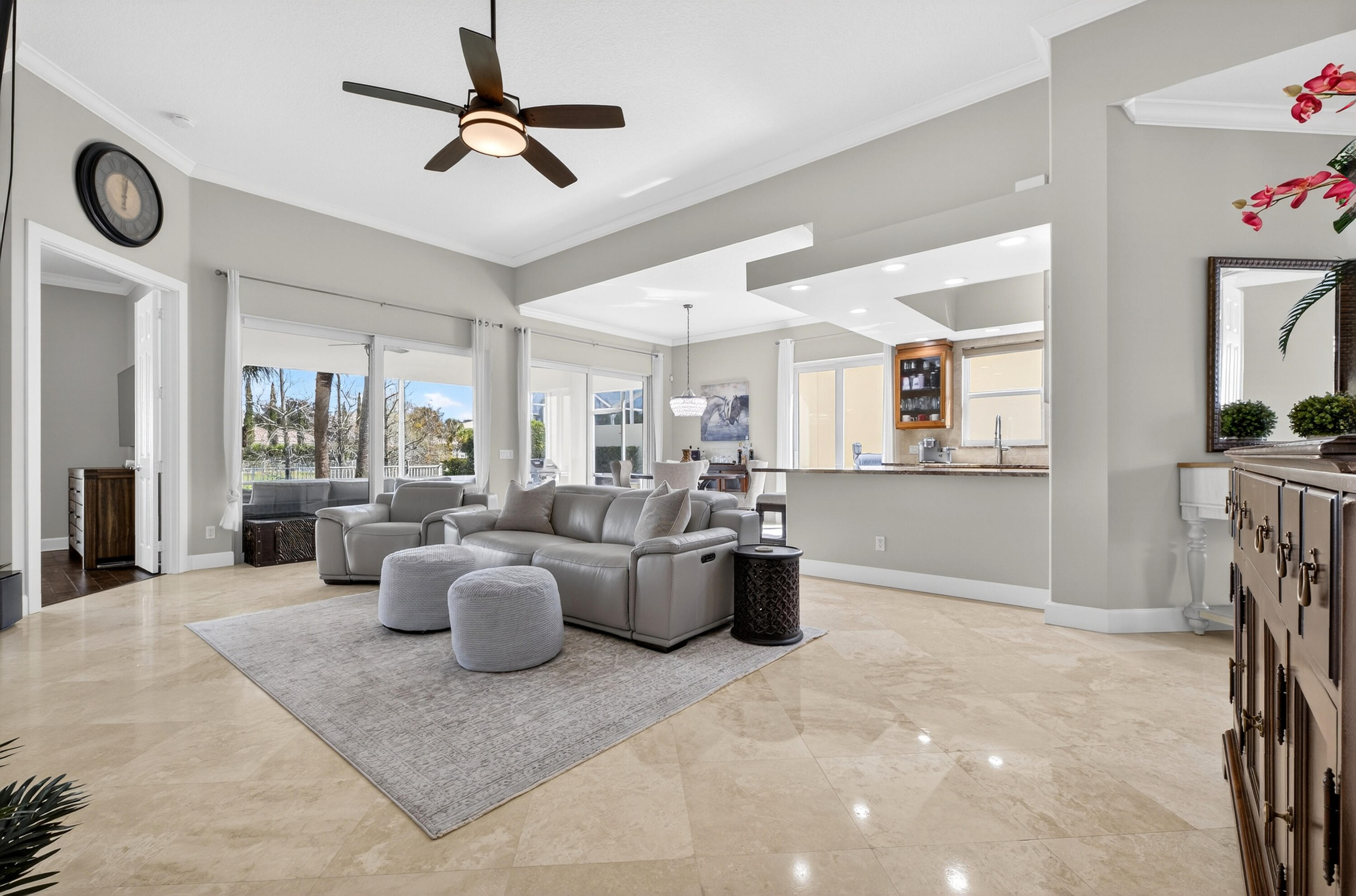 8223 Pine Cay Road Wellington, FL 33414 - Photo 12 of 60 a view of a livingroom with furniture and a ceiling fan