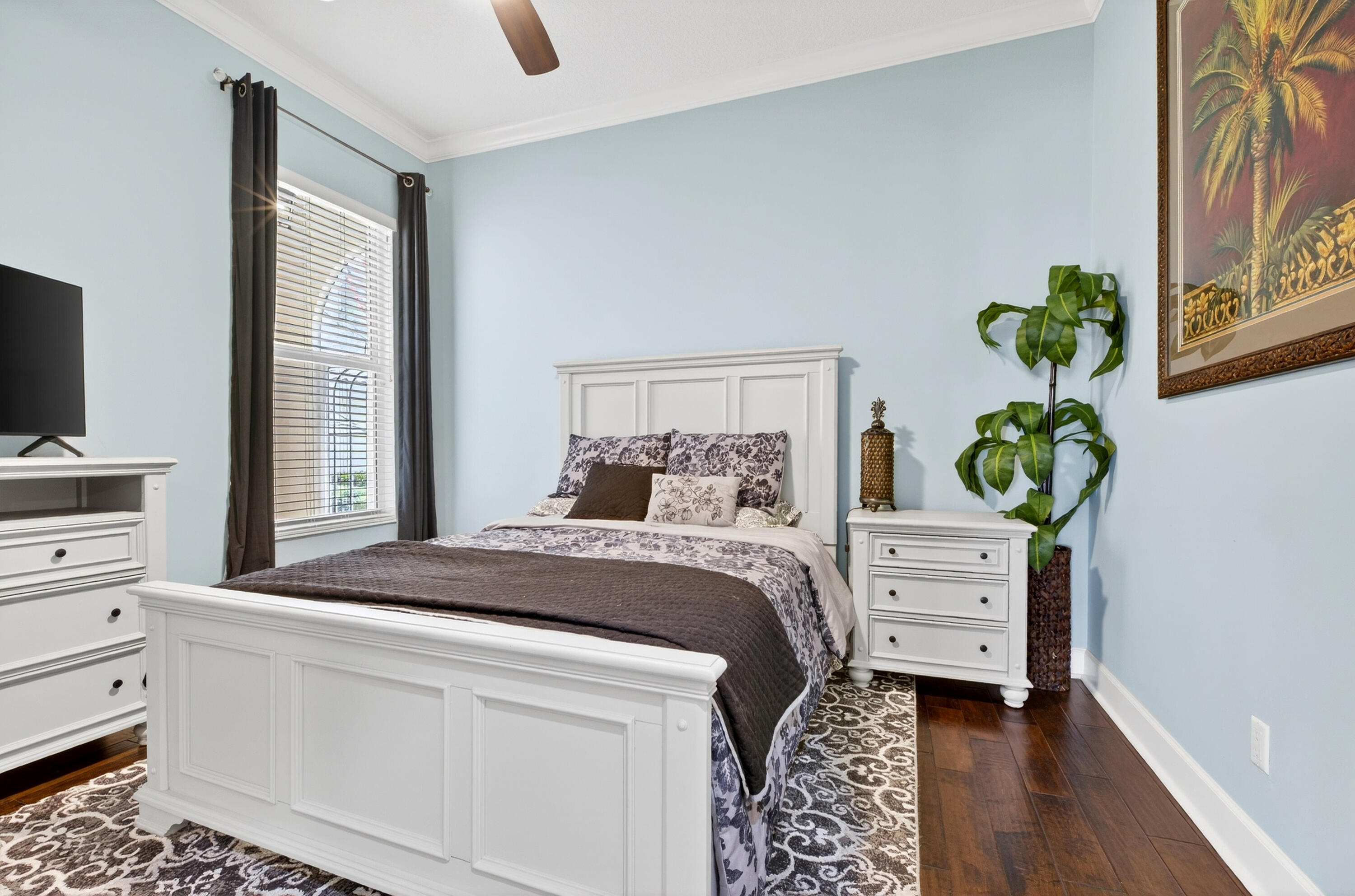 8223 Pine Cay Road Wellington, FL 33414 - Photo 23 of 60 a bedroom with a bed dresser and a window