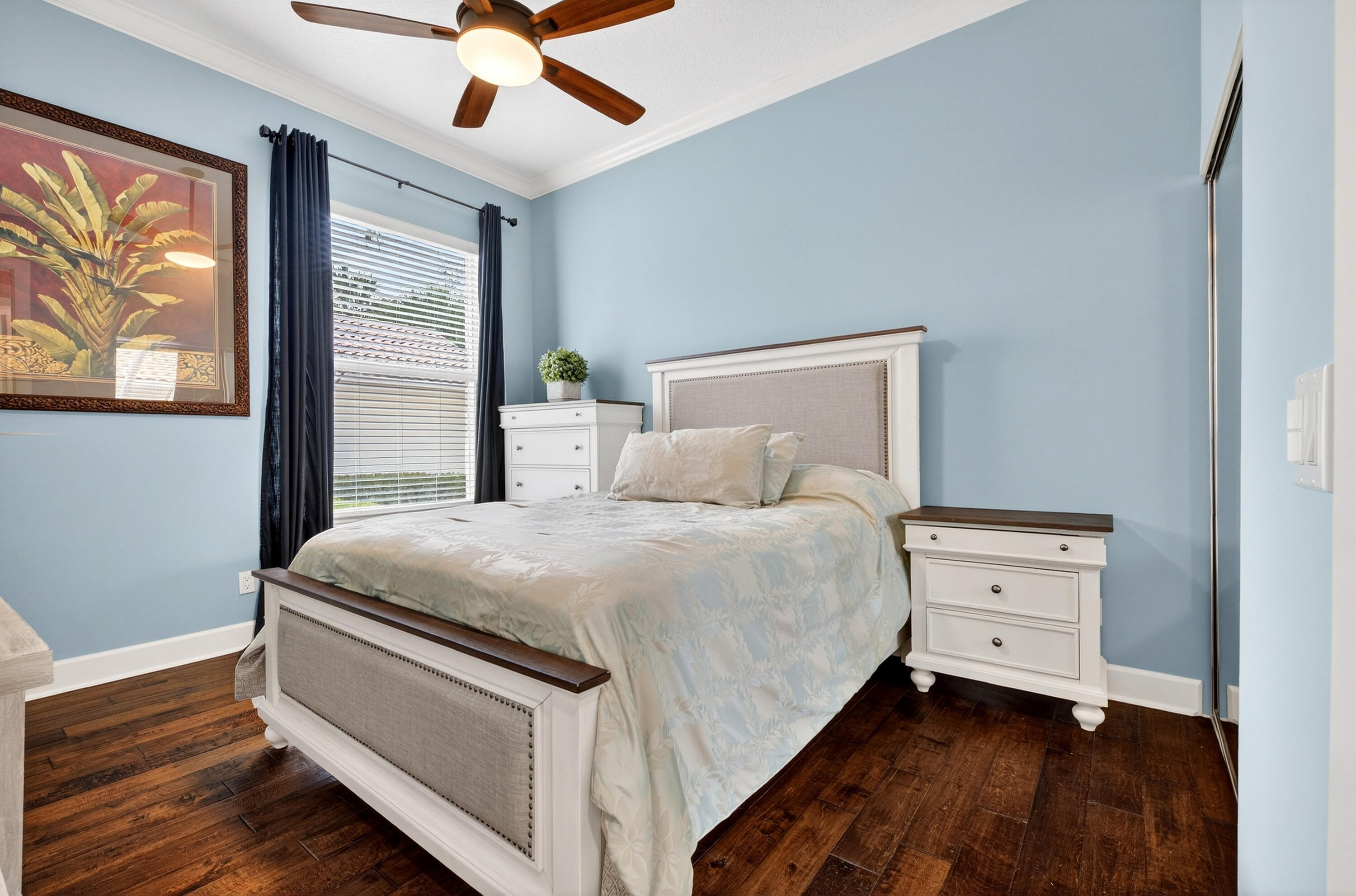 8223 Pine Cay Road Wellington, FL 33414 - Photo 24 of 60 a bedroom with a bed and a window