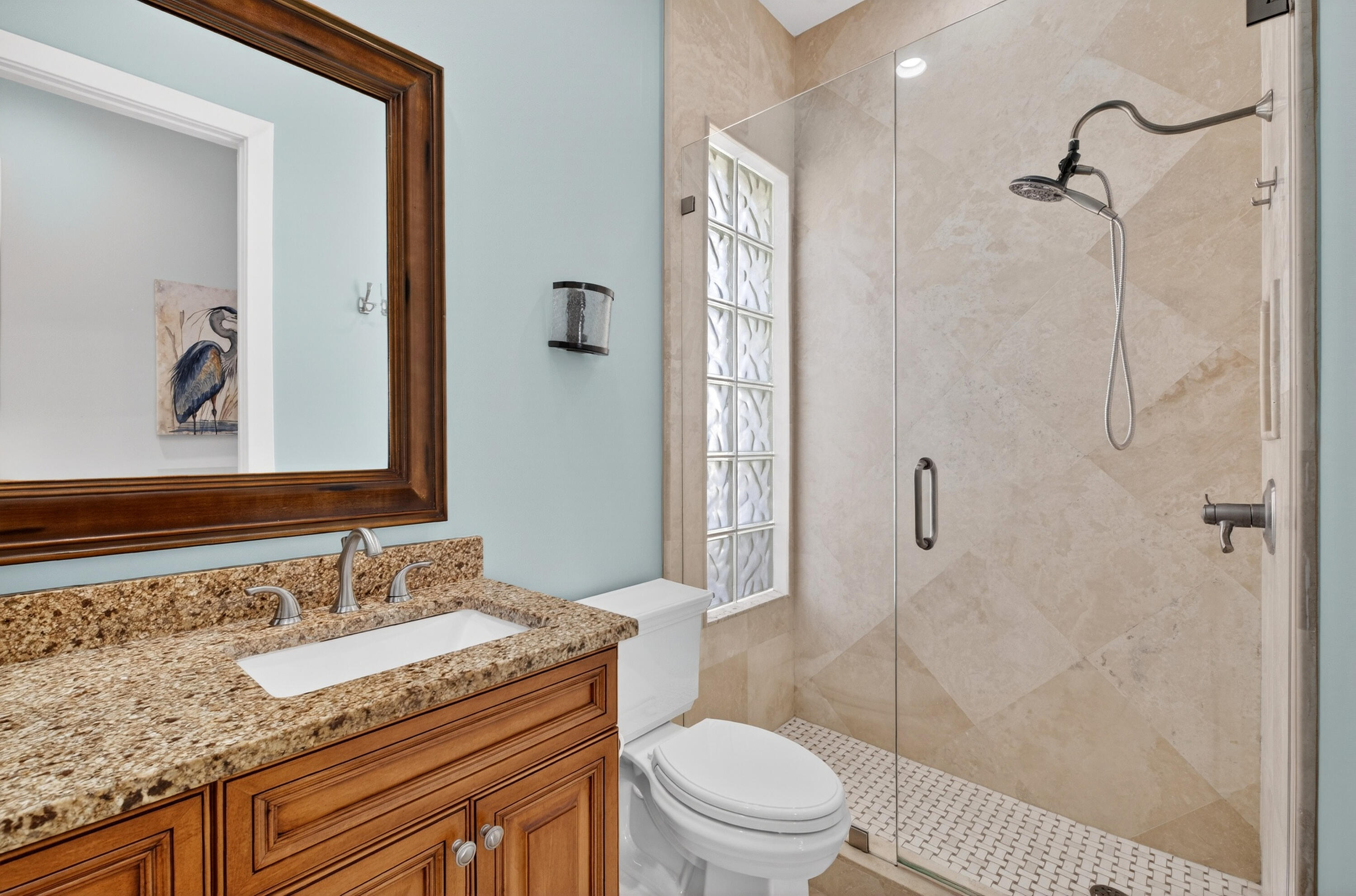 8223 Pine Cay Road Wellington, FL 33414 - Photo 28 of 60 a bathroom with a granite countertop sink a toilet and shower