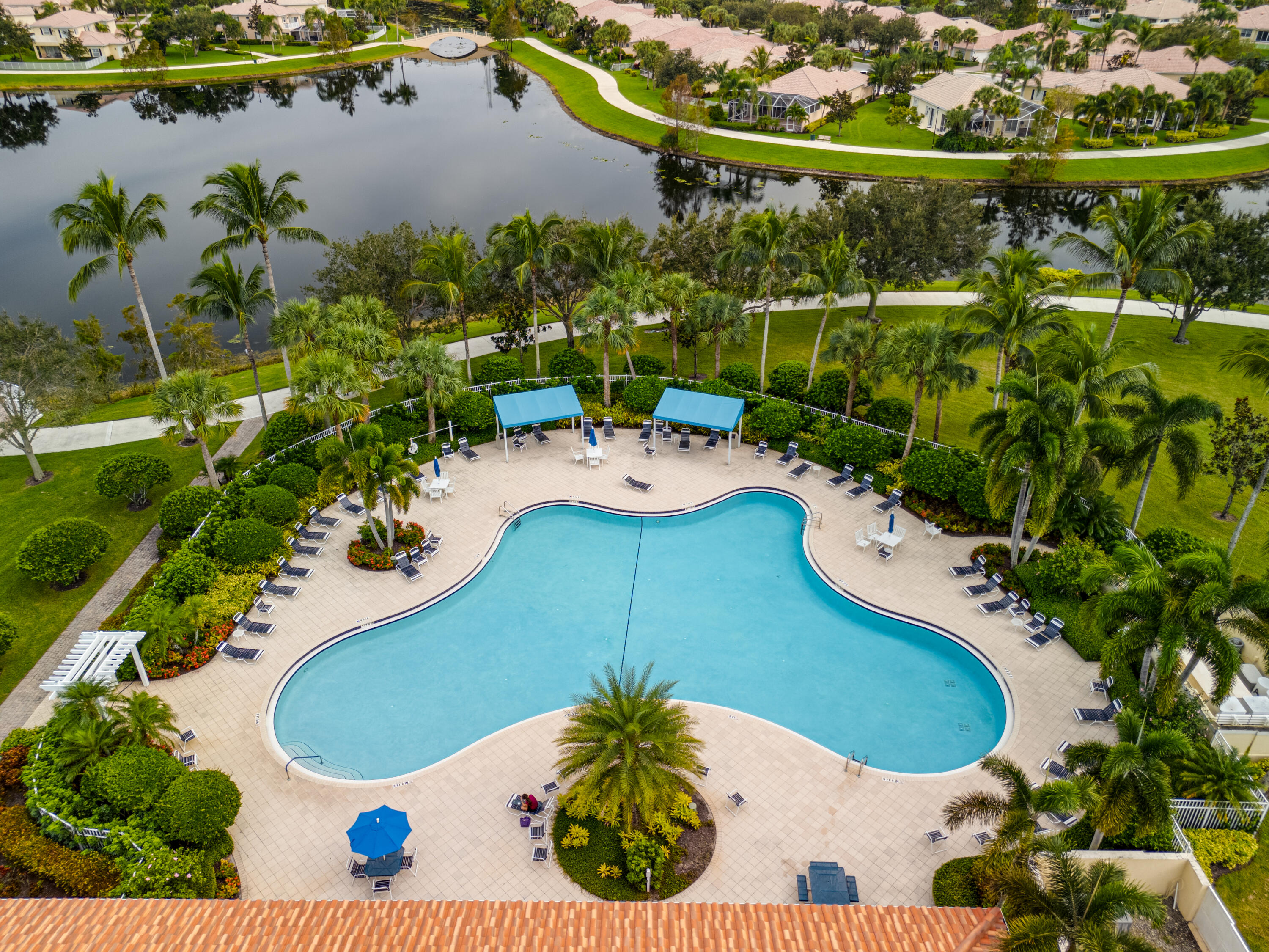 8223 Pine Cay Road Wellington, FL 33414 - Photo 36 of 60 an aerial view of a house a yard and lake view