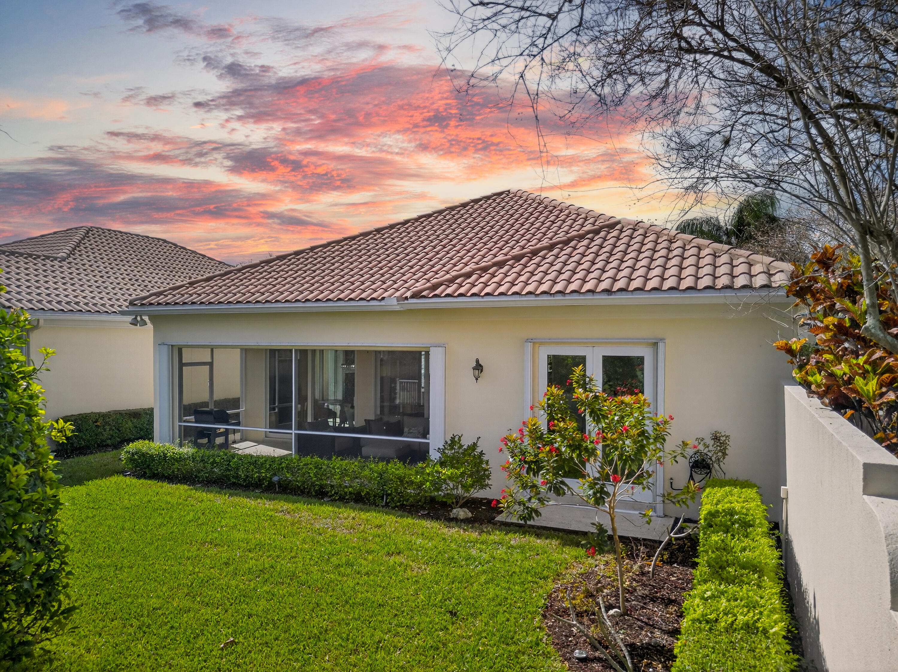 8223 Pine Cay Road Wellington, FL 33414 - Photo 47 of 60 a front view of a house with a yard