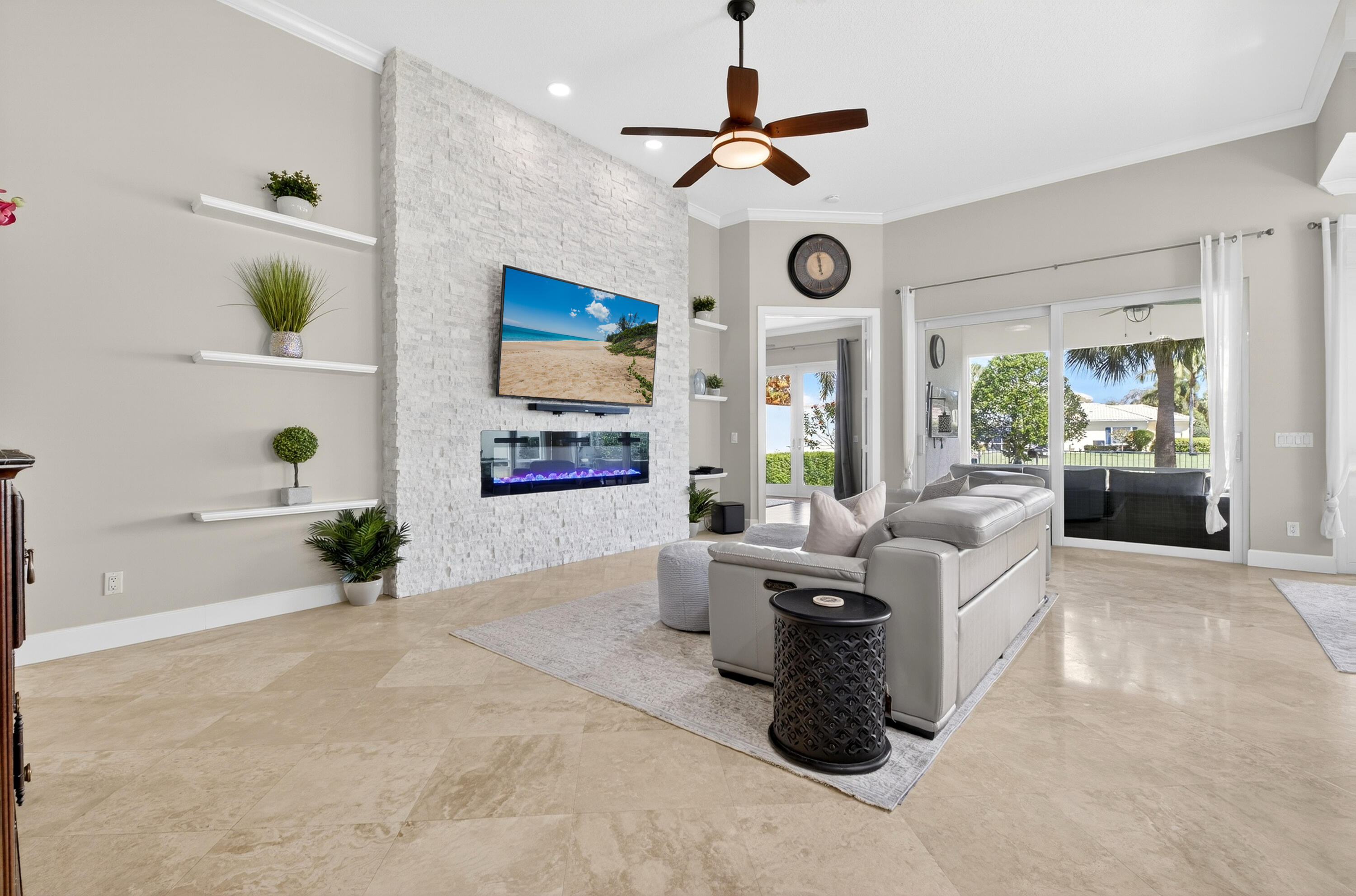 8223 Pine Cay Road Wellington, FL 33414 - Photo 10 of 60 a living room with patio furniture and a window