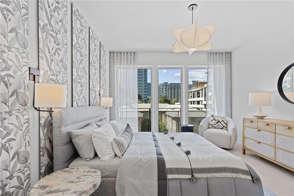 775 Juniper Street Northeast, Unit 227 Atlanta, GA 30308 - Photo 15 of 42 a living room with furniture and a large window