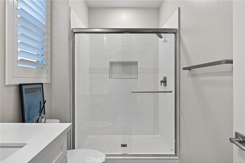 382 Chorus Irvine, CA 92618 - Photo 18 of 38 a bathroom with a shower and a toilet