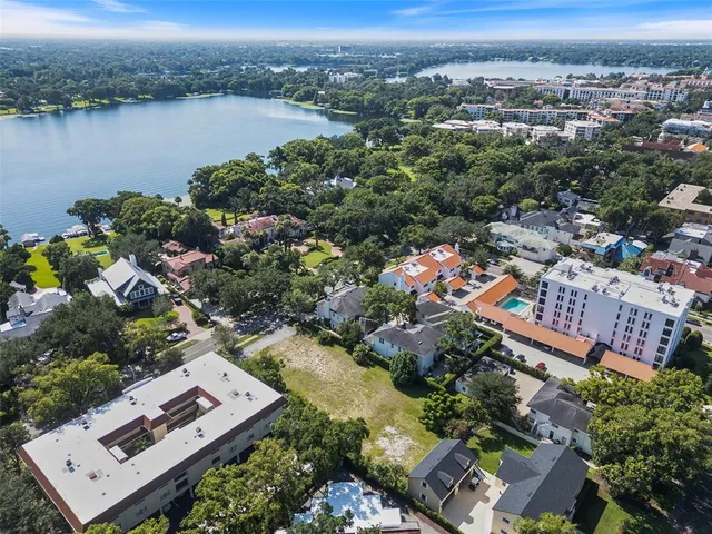 an aerial view of a city with lake view