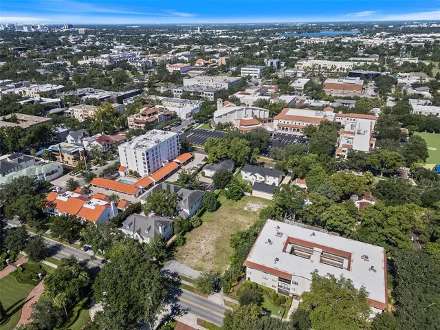 an aerial view of residential building with green space