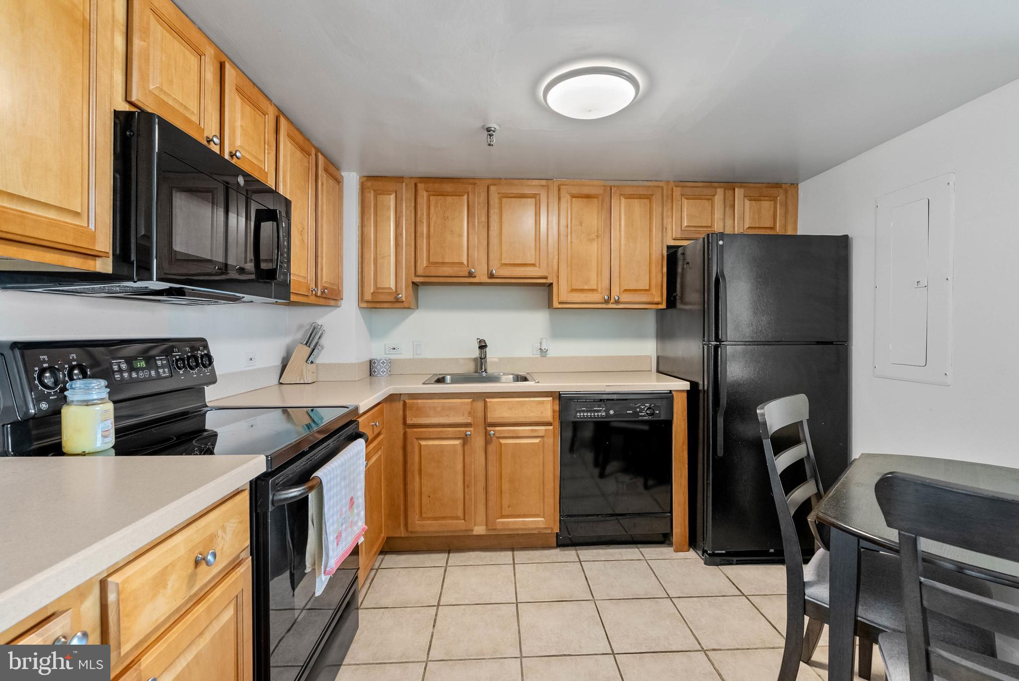 2001 Hamilton Street, Unit 507 Philadelphia, PA 19130 - Photo 2 of 41 a kitchen with granite countertop a refrigerator stove top oven and sink