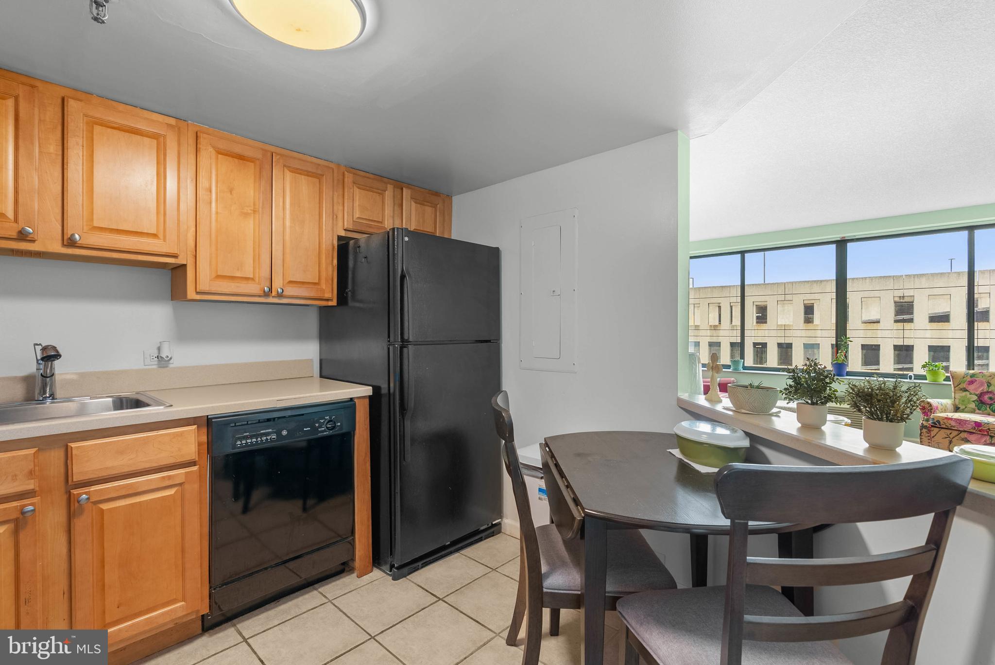 2001 Hamilton Street, Unit 507 Philadelphia, PA 19130 - Photo 3 of 41 a kitchen with a table chairs and refrigerator