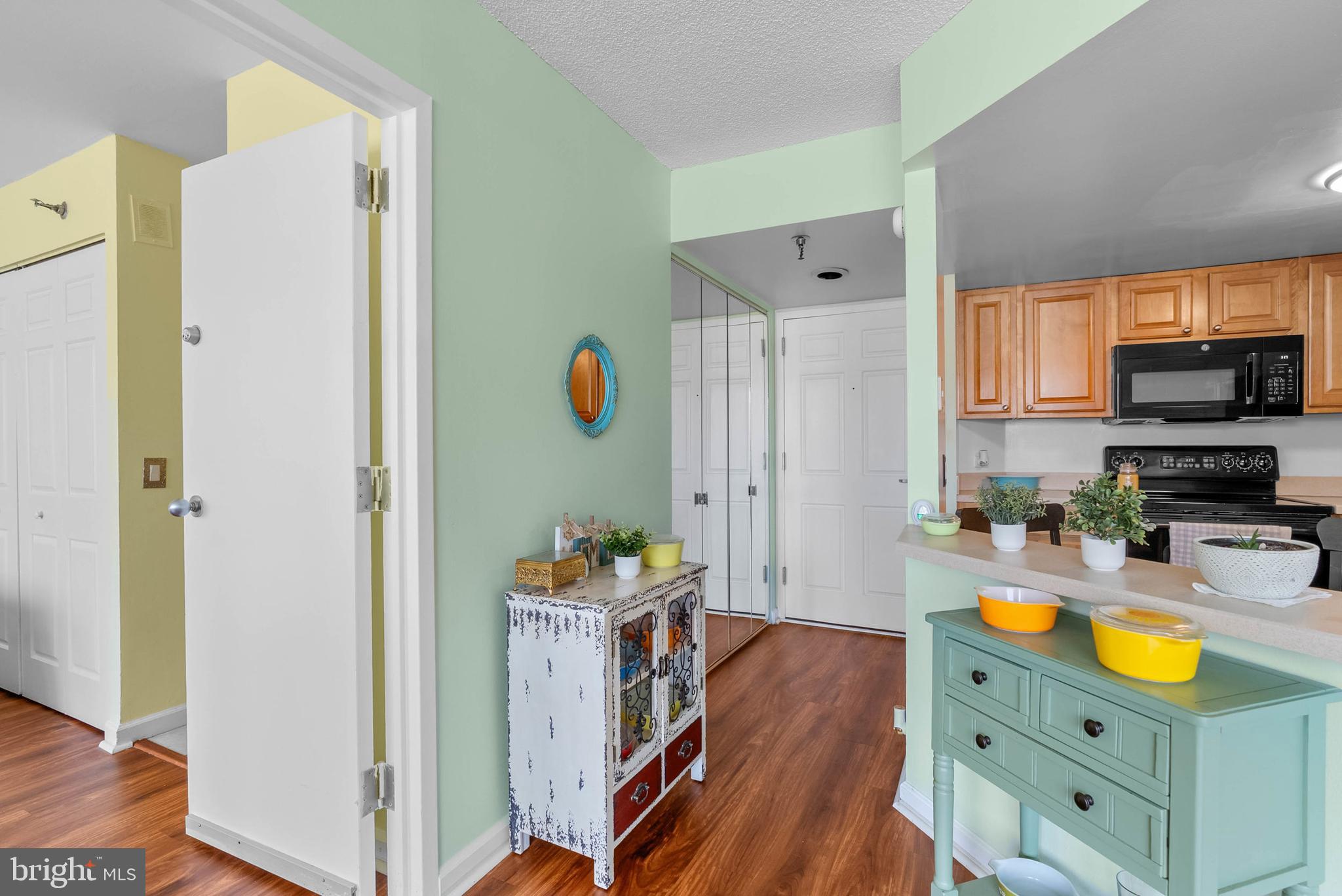 2001 Hamilton Street, Unit 507 Philadelphia, PA 19130 - Photo 5 of 41 a kitchen with stainless steel appliances granite countertop a refrigerator and a wooden floor
