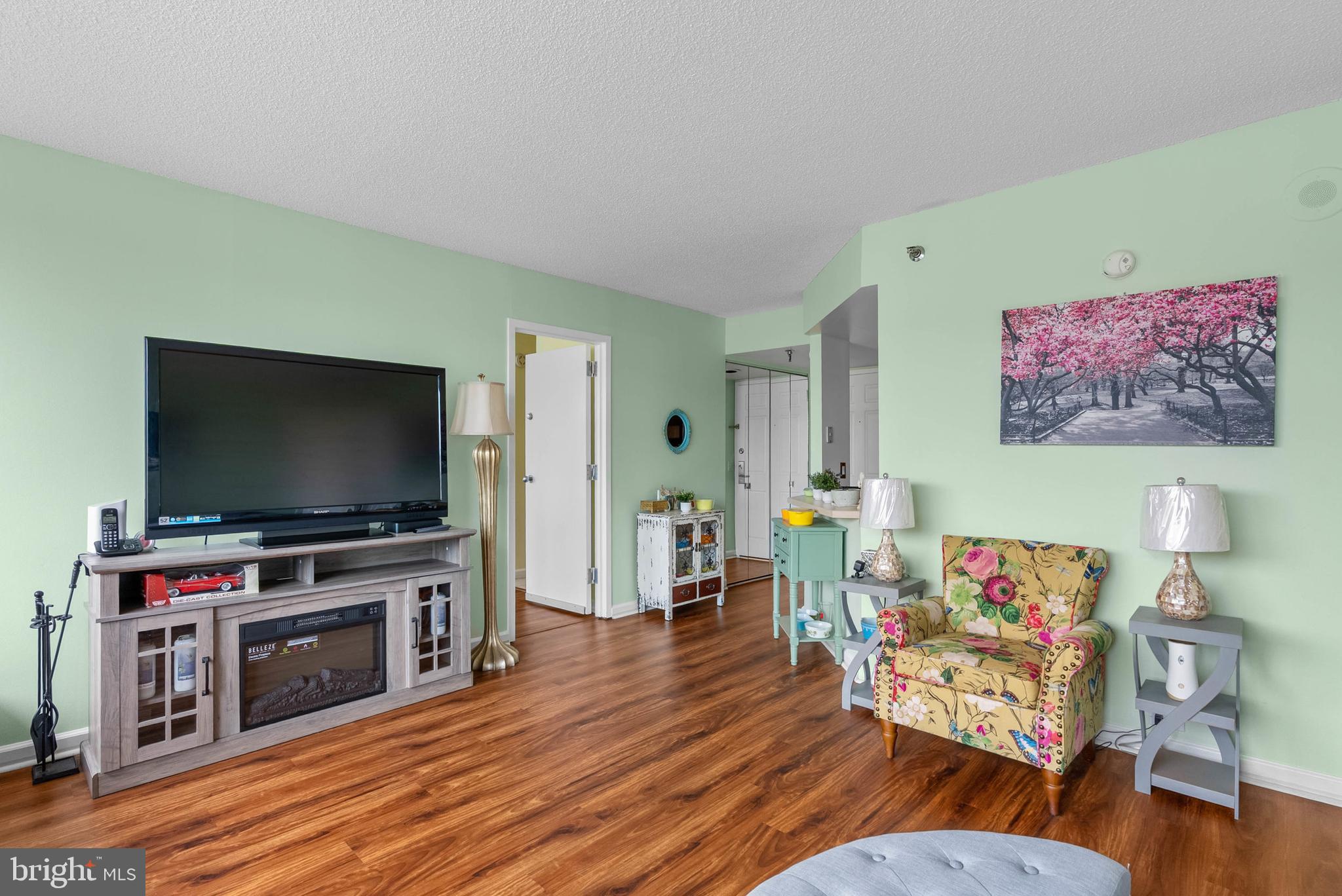 2001 Hamilton Street, Unit 507 Philadelphia, PA 19130 - Photo 8 of 41 a living room with furniture and a flat screen tv