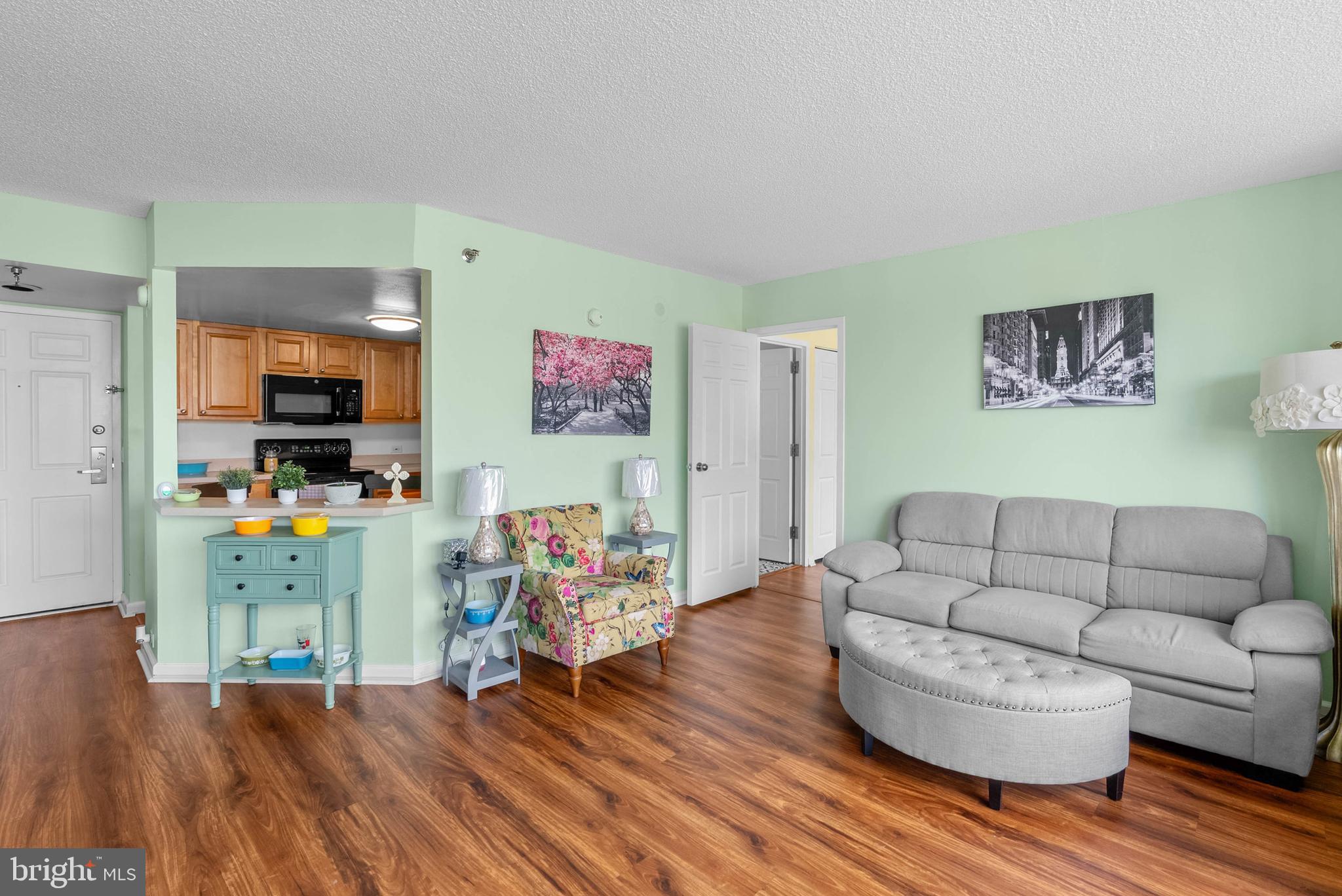2001 Hamilton Street, Unit 507 Philadelphia, PA 19130 - Photo 9 of 41 a living room with furniture and a wooden floor