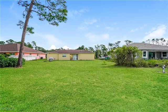 a view of a house with a big yard