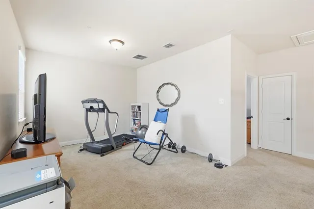 a view of a room with gym equipment