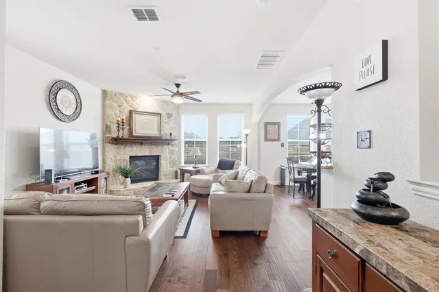 a living room with furniture and a fireplace