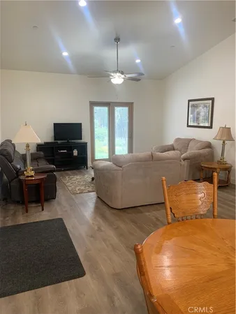 a bedroom with furniture and a flat screen tv