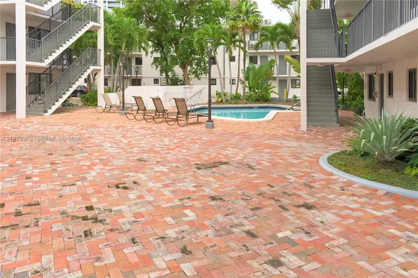 a view of a park with plants and trees