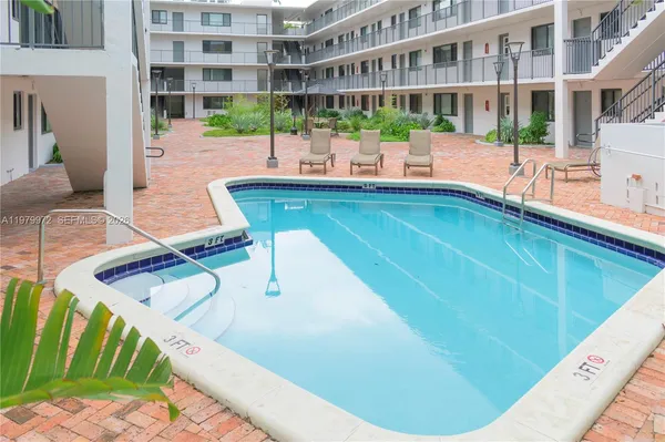 a view of a swimming pool with a patio