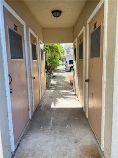 a view of a porch with wooden floor and outdoor space