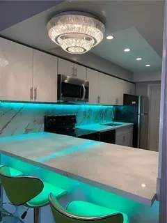 a kitchen with a table and chairs