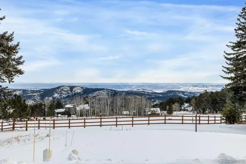 a bedroom with furniture and a flat screen tv