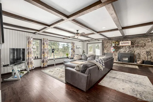 a kitchen with a table chairs refrigerator and cabinets