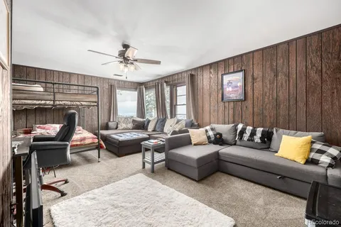 a view of a house with a backyard porch and sitting area