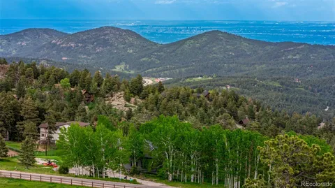 a bedroom with furniture and a wooden floor