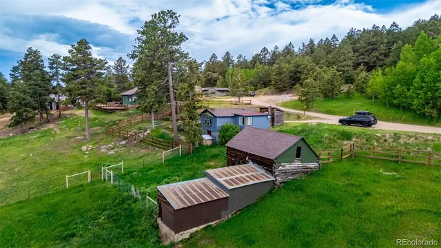 an aerial view of a house with a garden