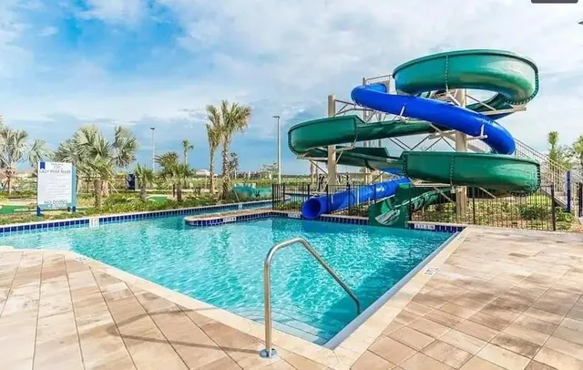 an aerial view of a house with outdoor space