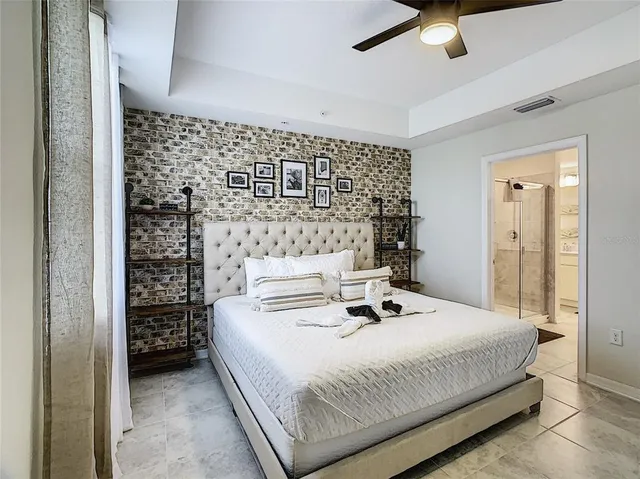 a bedroom with a bed and a table