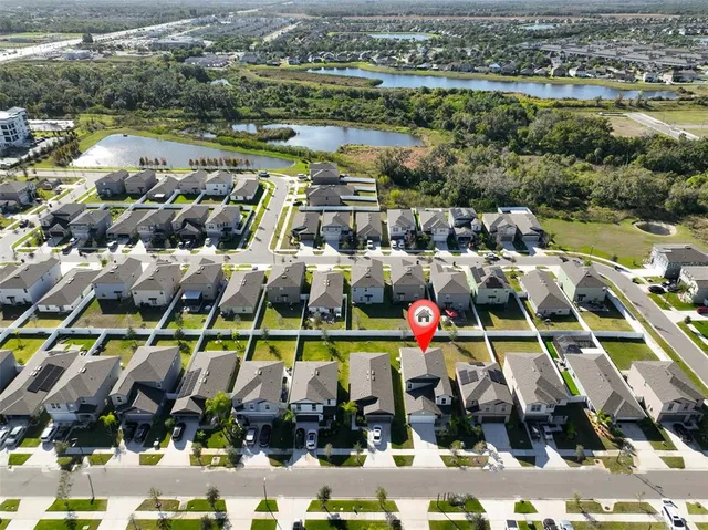 an aerial view of a city with lots of residential buildings