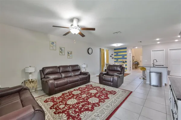 a living room with furniture and a rug