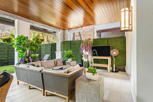 a view of an house with swimming pool and porch