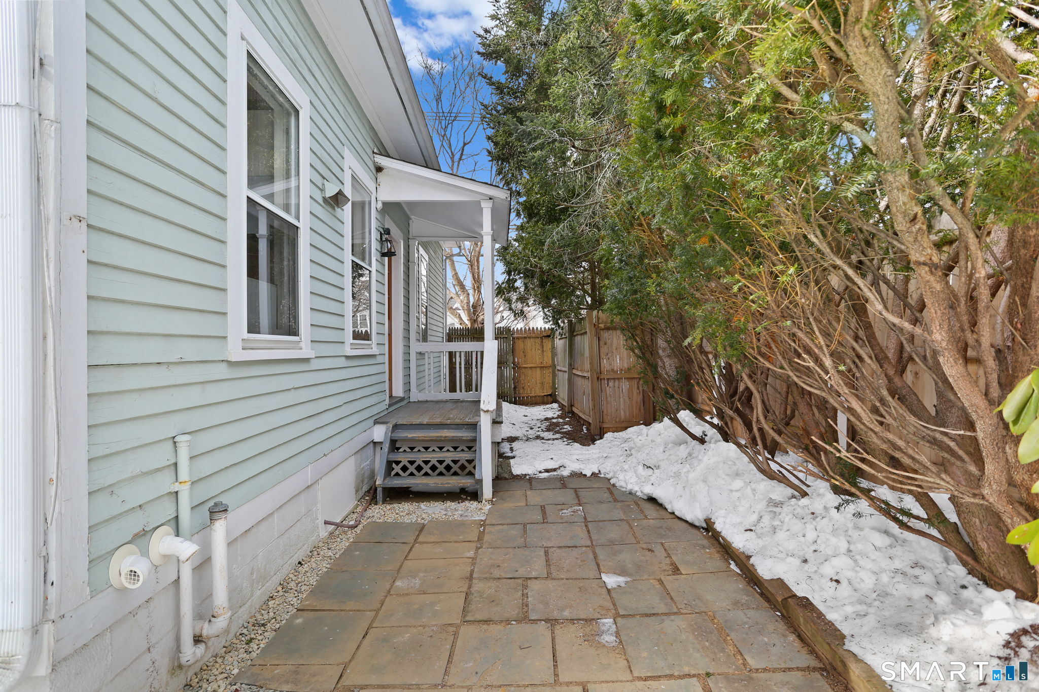 65 West Parish Road Westport, CT 06880 - Photo 27 of 32 side terrace and entrance