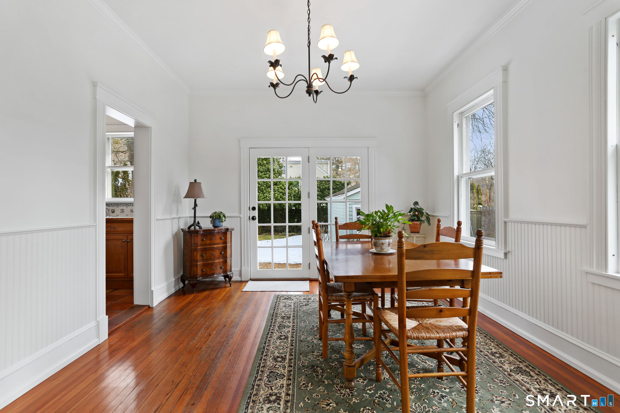 65 West Parish Road Westport, CT 06880 - Photo 7 of 32 Bright and sunny DR with doors to the deck and beautiful yard