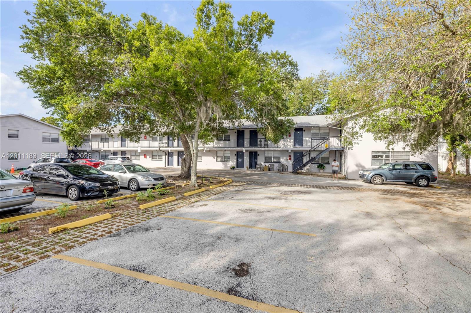 1208 South Ridgewood Avenue Daytona Beach, FL 32114 - Photo 7 of 27 a view of a street with cars park
