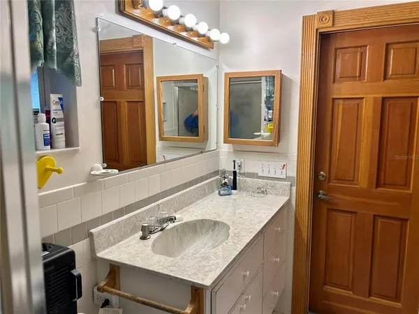 a bathroom with a sink and a mirror