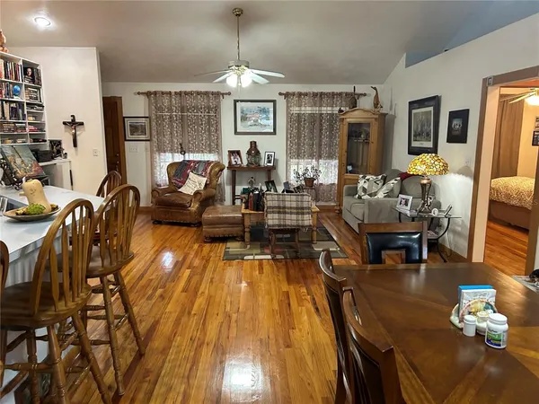 a living room with fireplace furniture and a chandelier