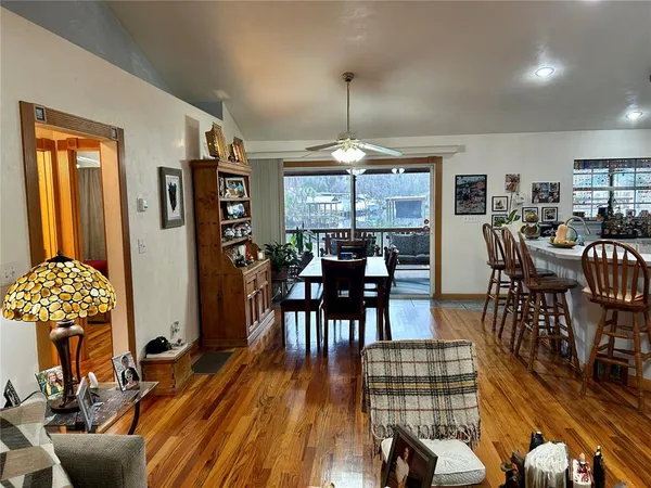 a view of a dining room with furniture window and wooden floor