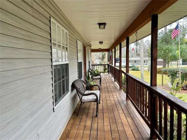 a view of two chairs in the balcony