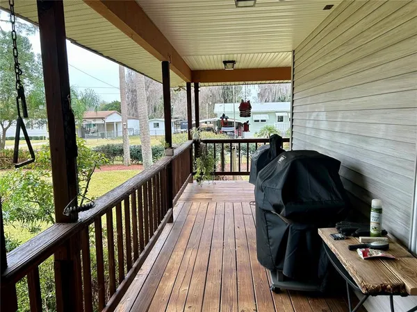 a view of a balcony with furniture